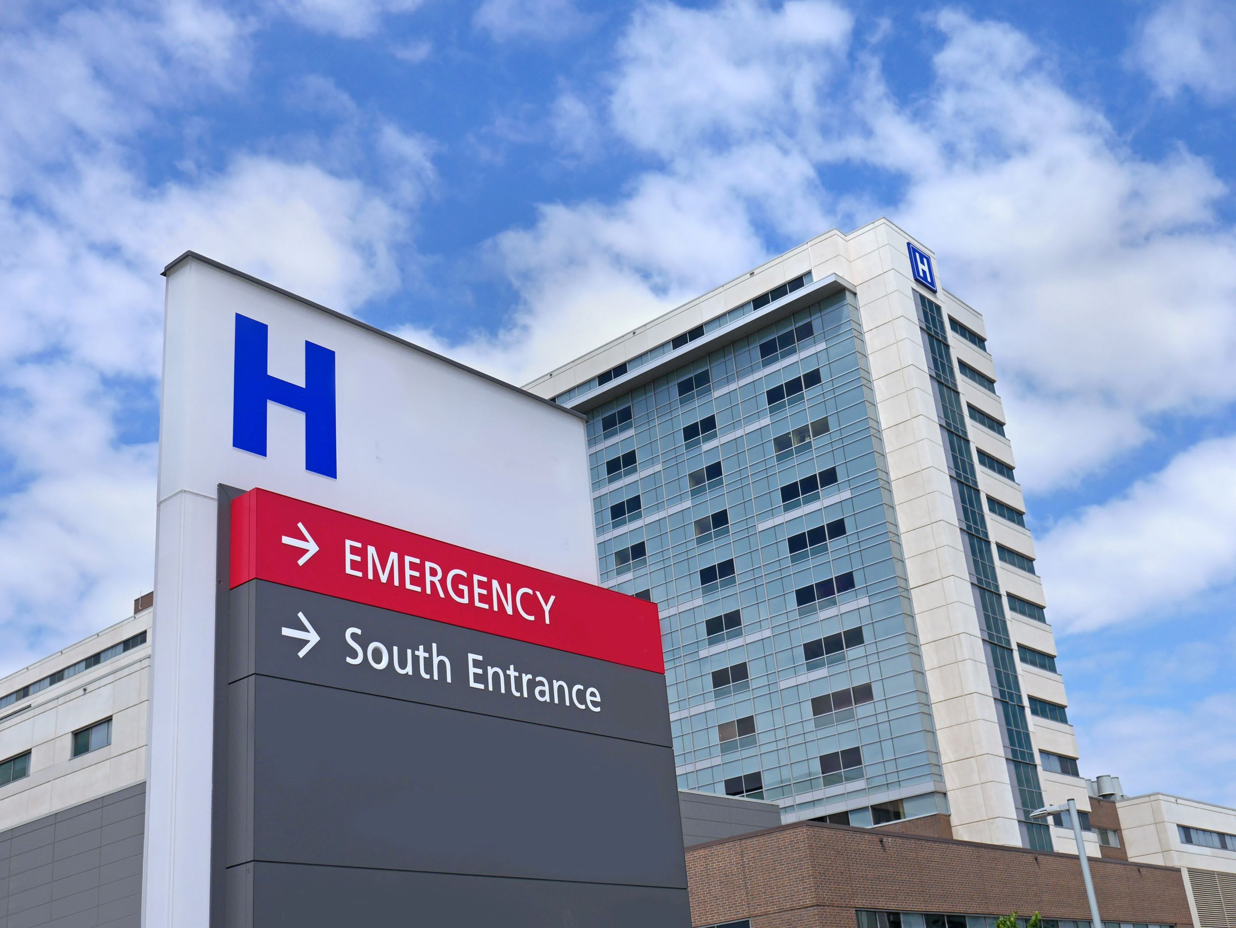 A hospital with an entrance sign